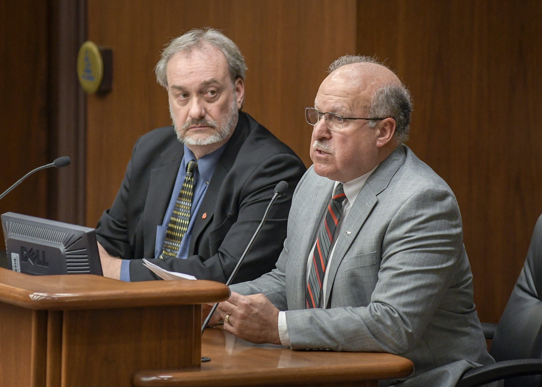 DNR Fish and Wildlife Director James Leach testifies Feb. 21 on a bill sponsored by Rep. Rick Hansen, left, that would provide wildlife disease surveillance and response funding. Photo by Andrew VonBank